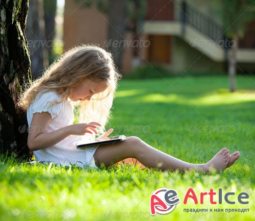 PhotoDune Child with tablet pc outdoors 6694402