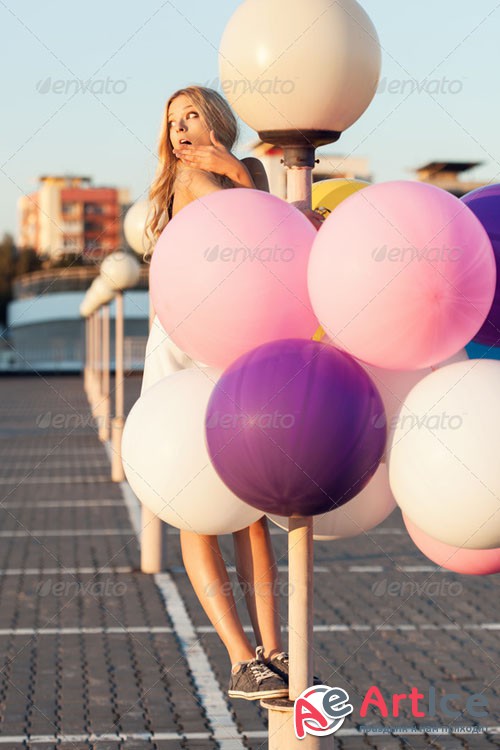 PhotoDune Happy young woman with colorful latex balloons 6308990