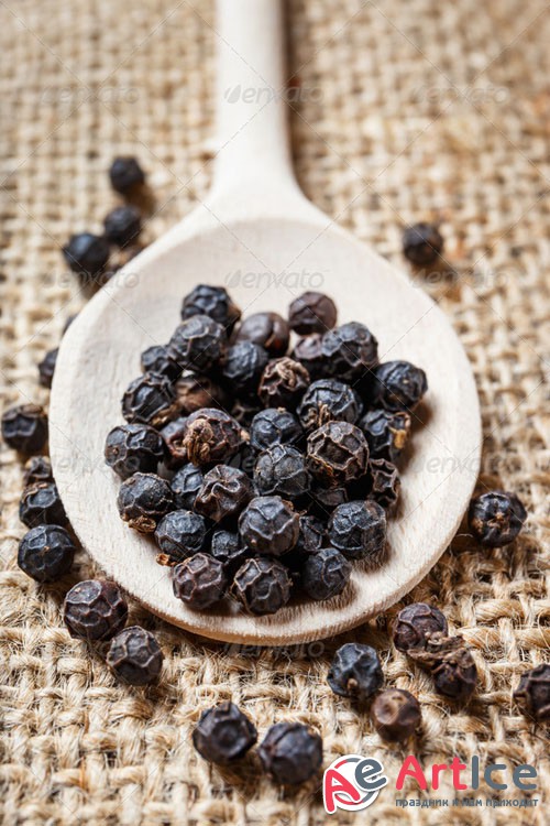 Black pepper on the wooden spoon - Photodune 8779780